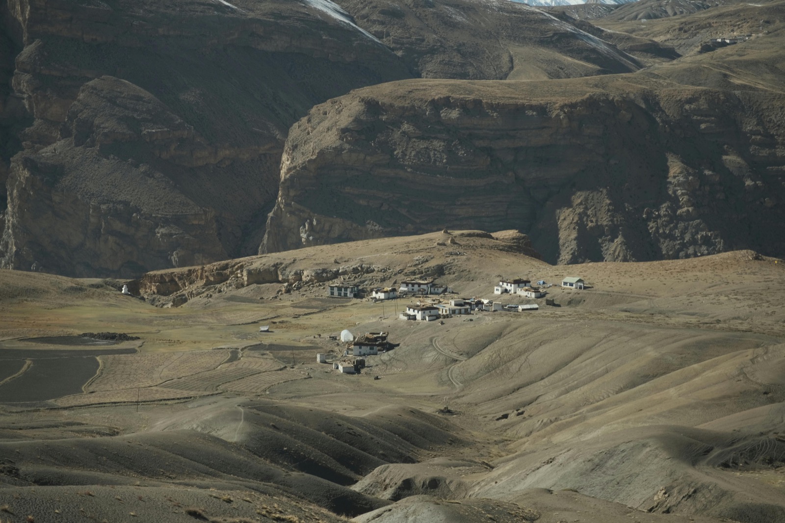 Motorcycle on high grazing plateau above Spiti Valley near Demul village